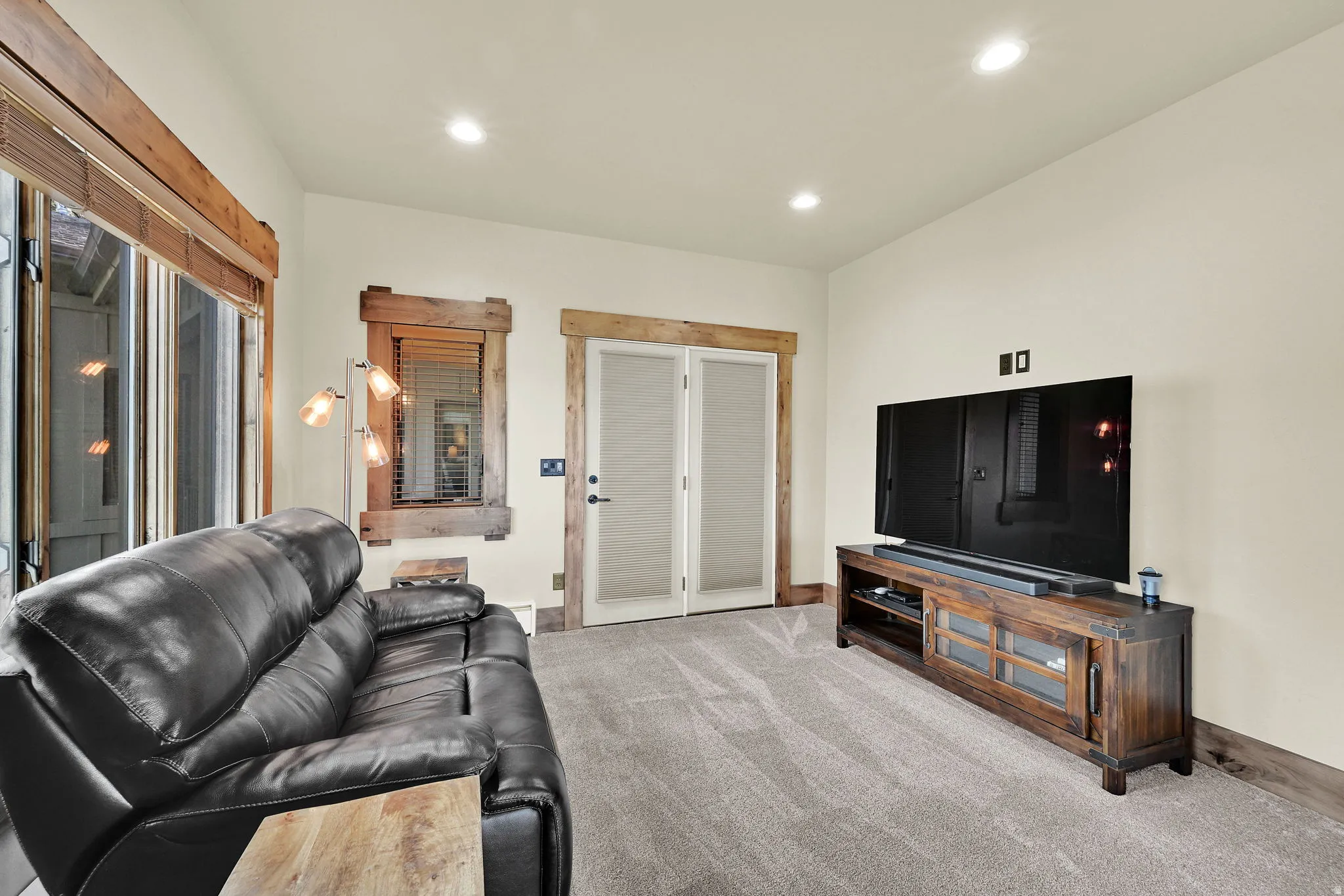 Living area featuring recessed lighting and light colored carpet
