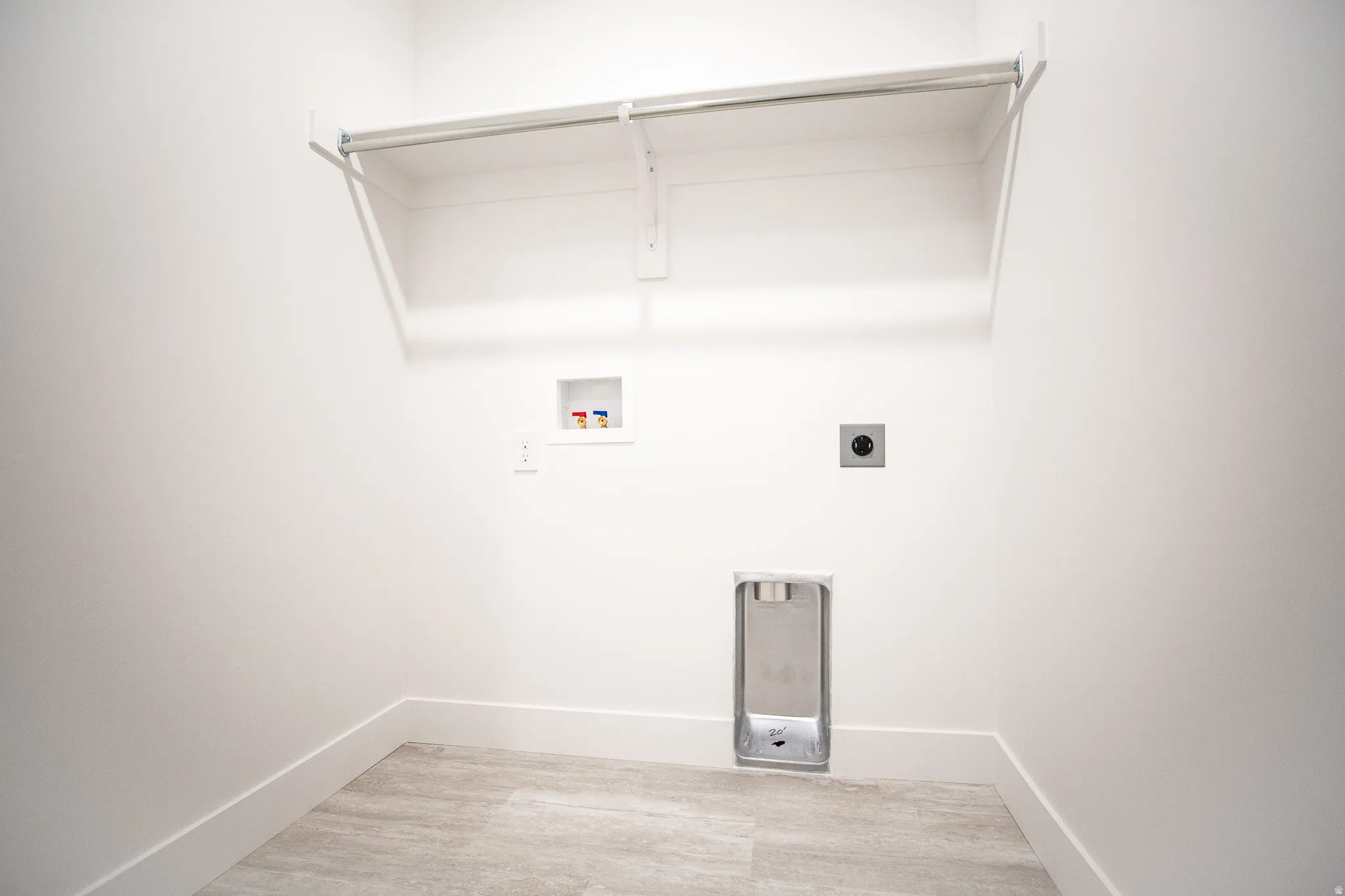 Laundry room with hookups for an electric washer and dryer