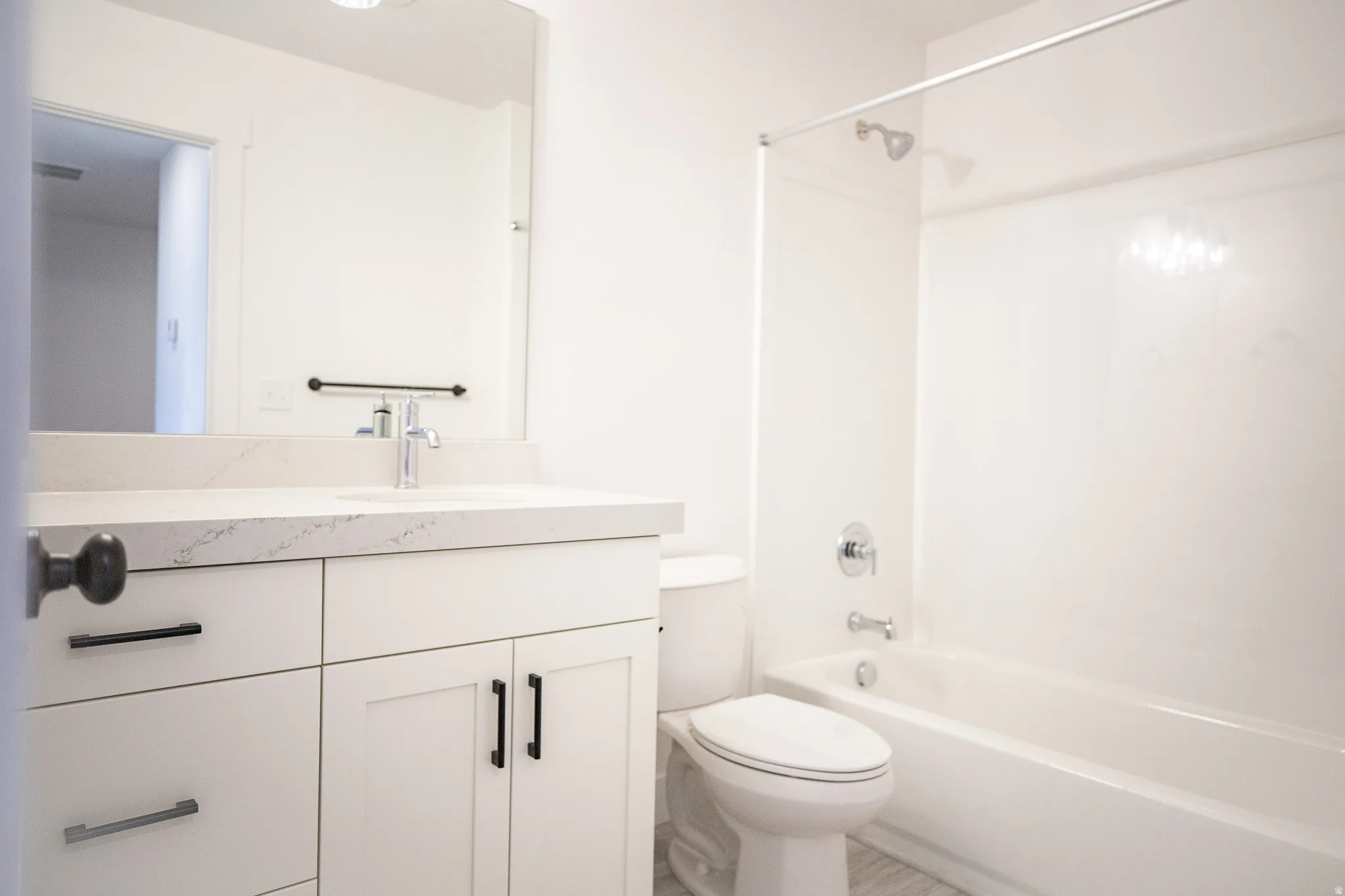 Hall bathroom with vanity and shower / bath combination