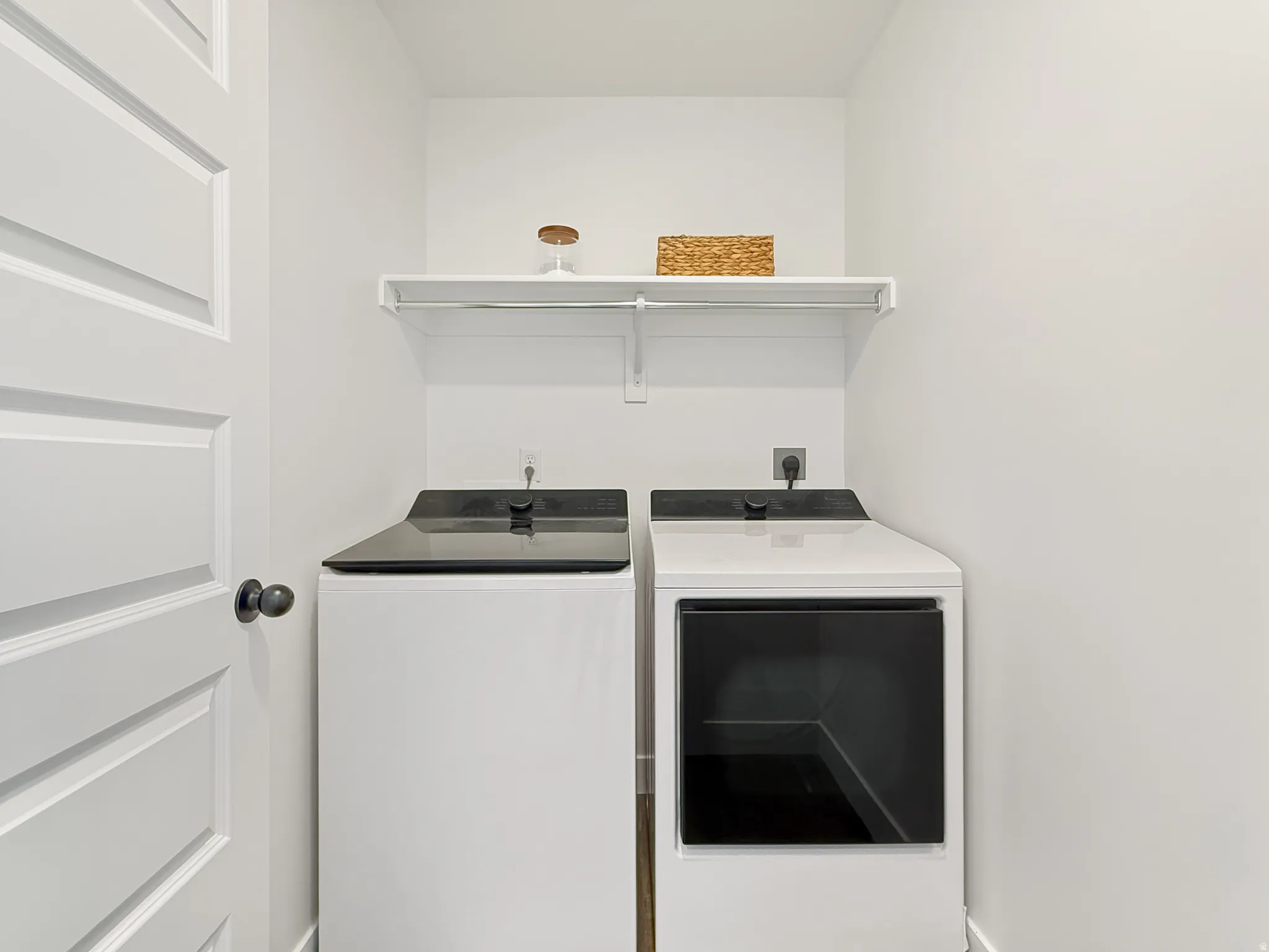 Laundry area with washing machine and clothes dryer