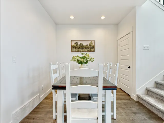 Dining area with recessed lighting and wood finished floors