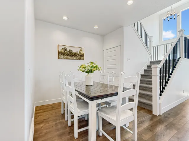 Dining room featuring wood finished floors and suspended lighting