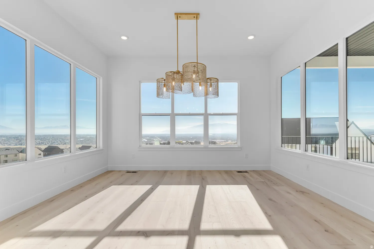 Unfurnished sunroom with a chandelier