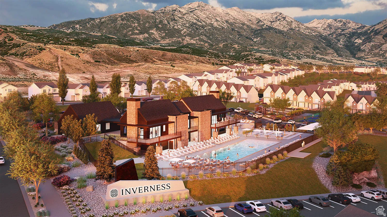 Aerial perspective of suburban area featuring a mountain backdrop and a pool