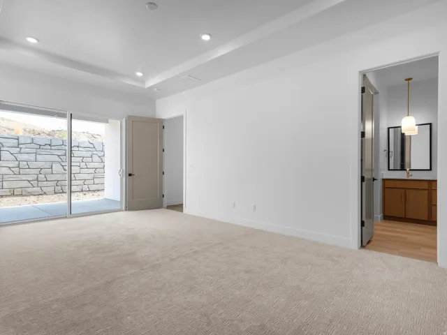 Neutral tone carpeting and white walls