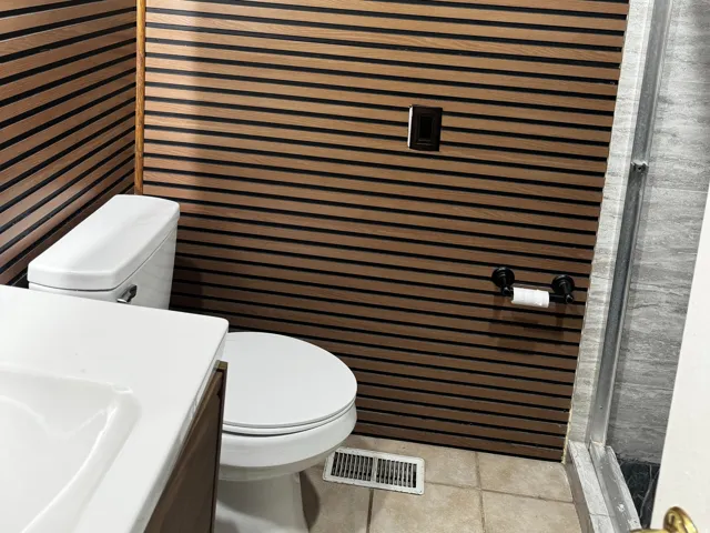 Full bathroom with vanity, a shower stall, and light tile patterned flooring