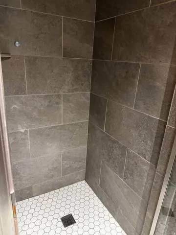 Bathroom featuring a shower stall