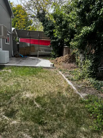 Fenced backyard featuring a patio and washer / clothes dryer