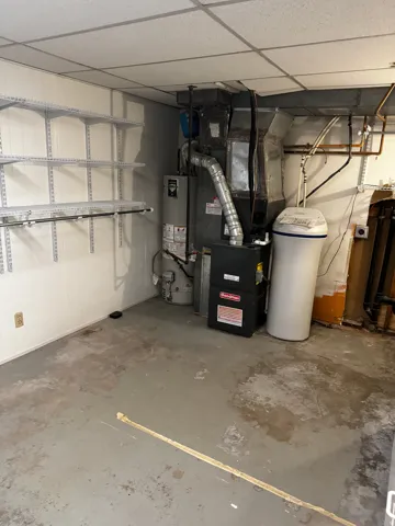 Utilities featuring gas water heater and heating unit