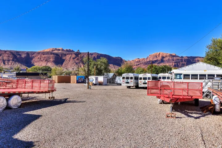 View of yard featuring a deck with mountain view