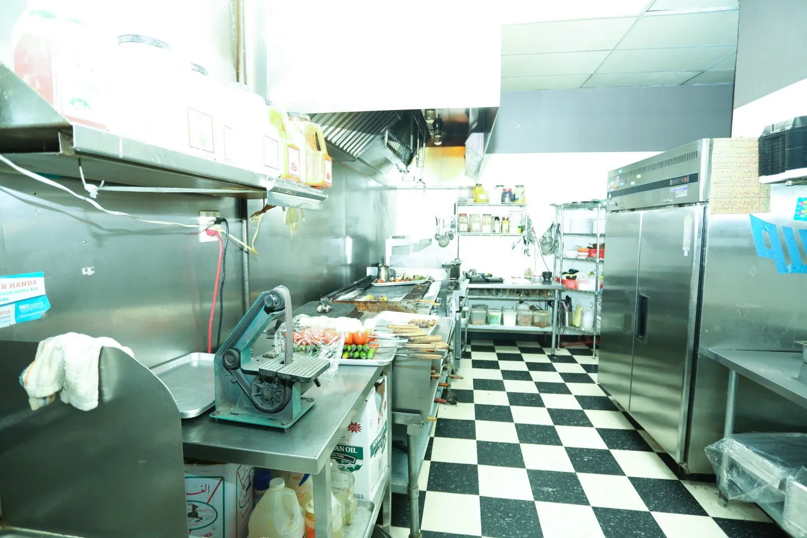 Kitchen with stainless steel fridge and a paneled ceiling
