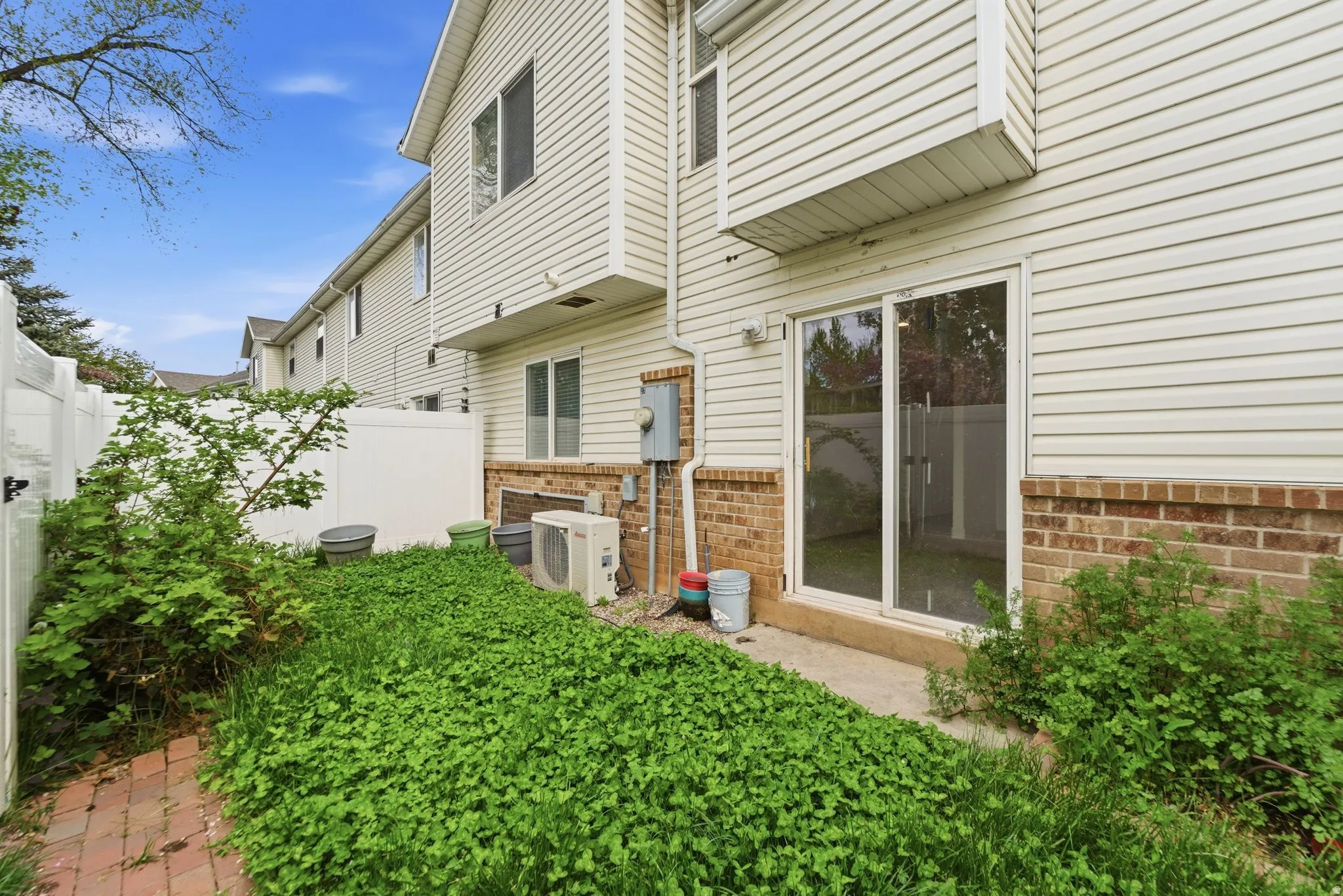 Back of property with brick siding