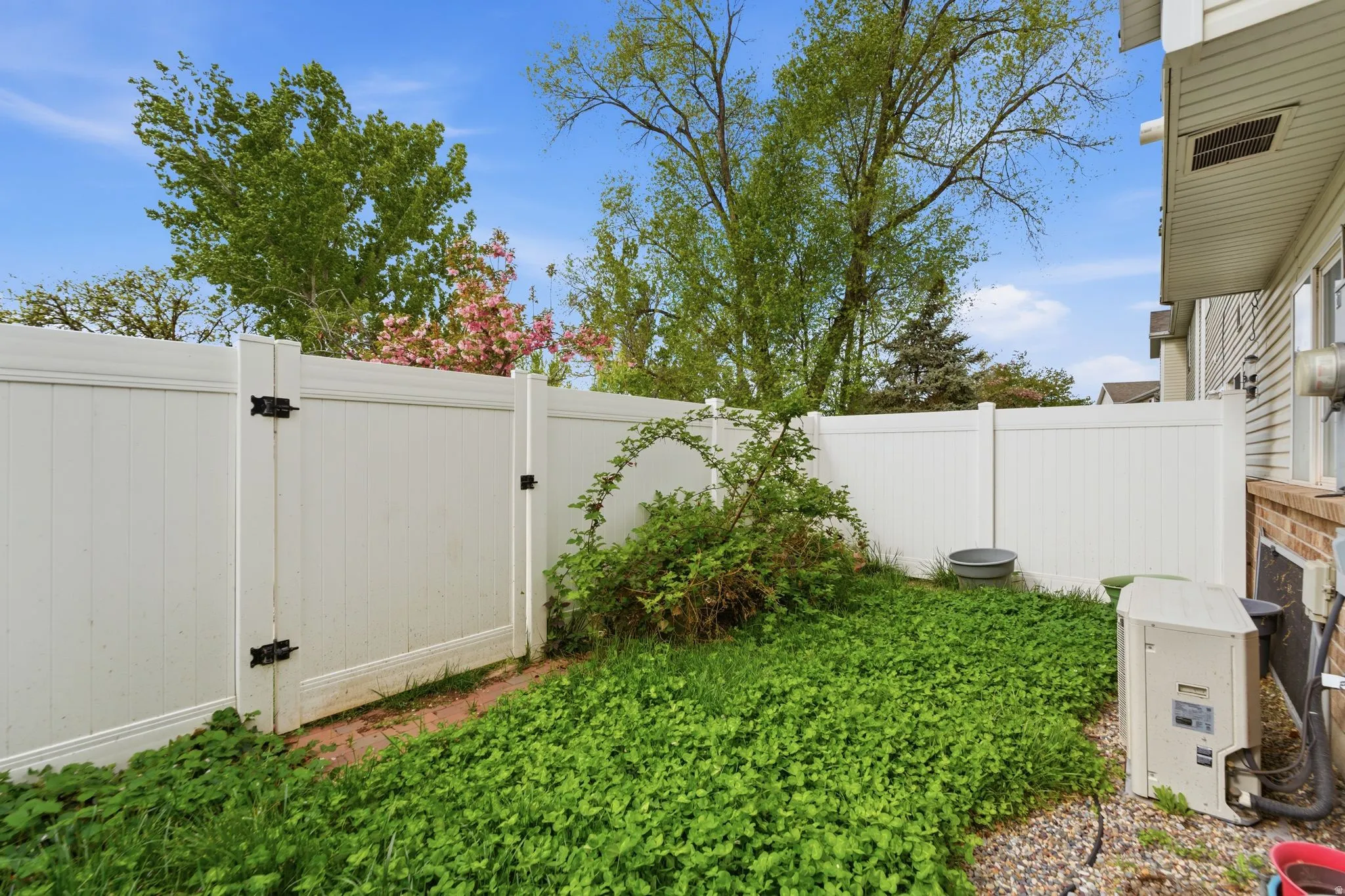 View of yard featuring a gate