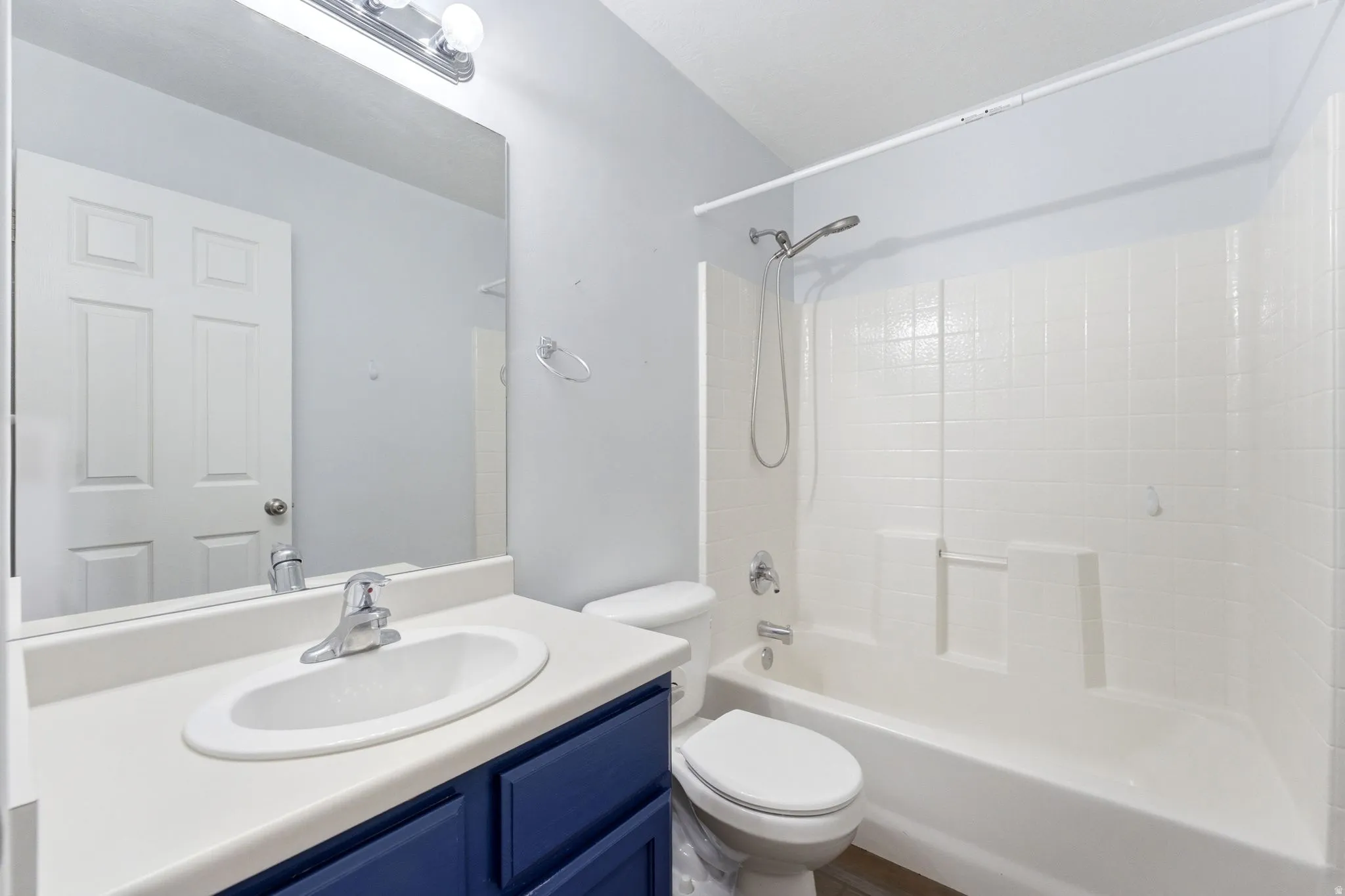 Full bath with vanity and bathtub / shower combination