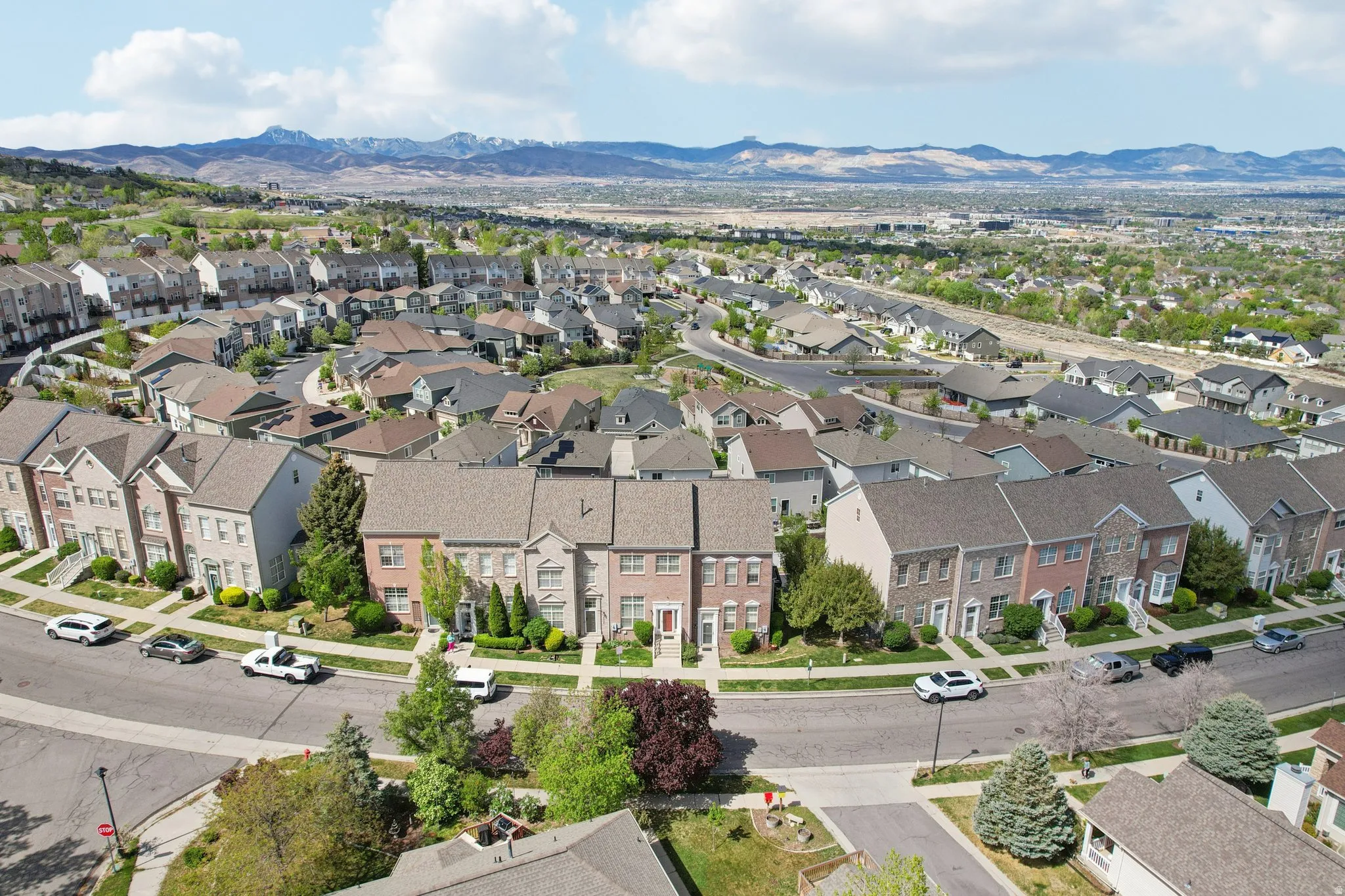 Aerial view of residential area featuring a mountain backdrop
