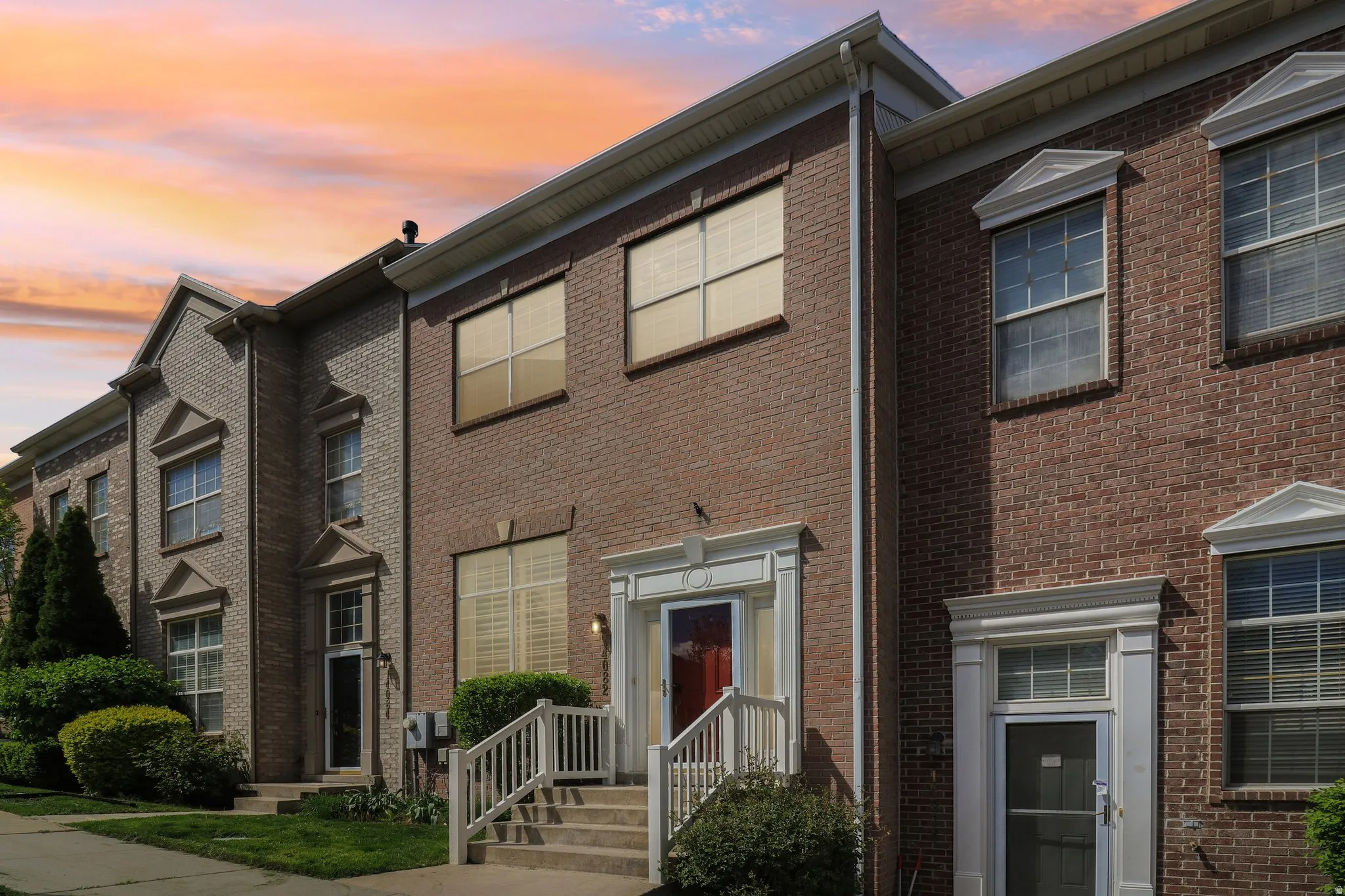 View of front facade featuring brick siding