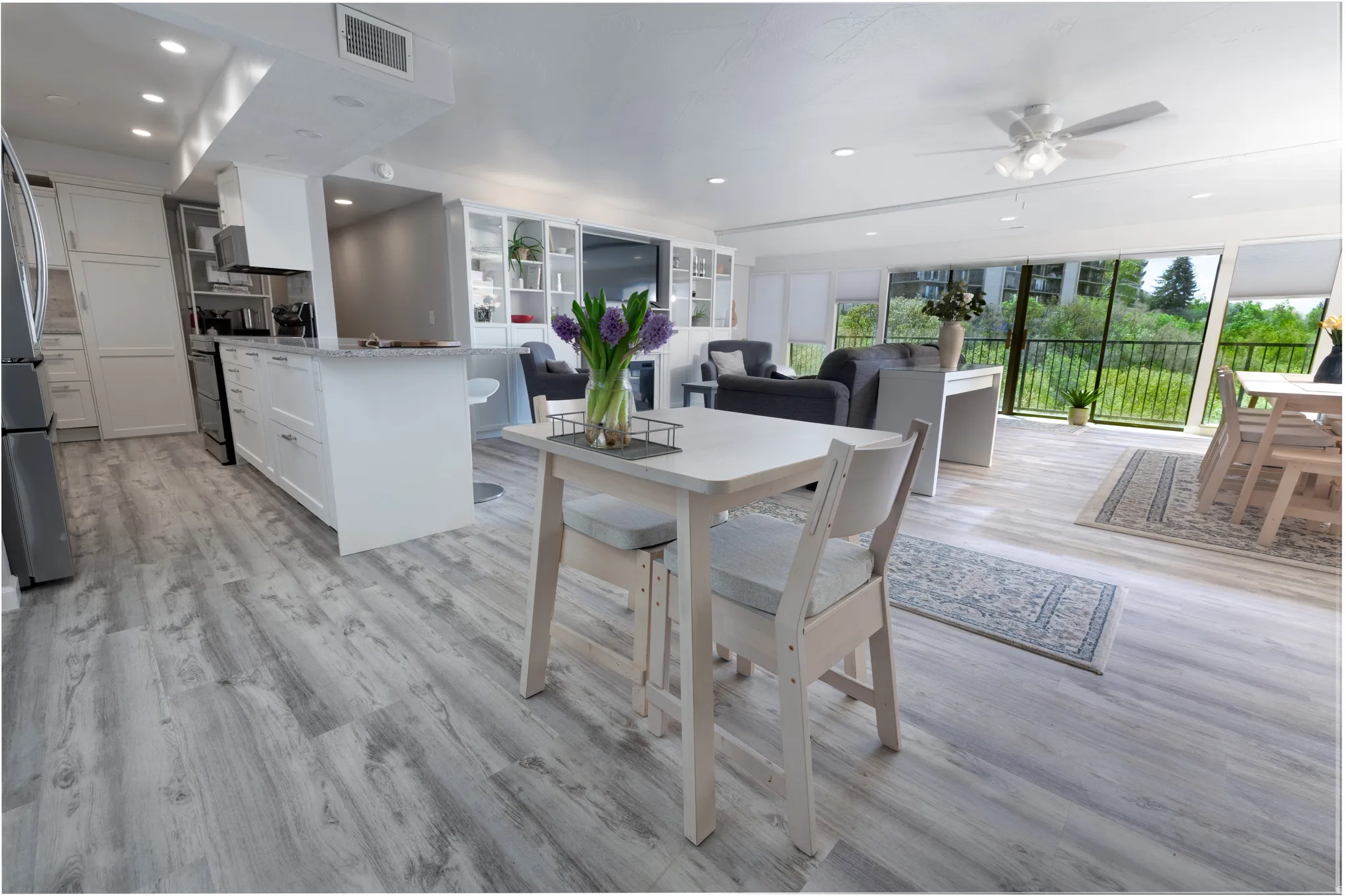 Dining space featuring a ceiling fan, recessed lighting, and light wood-style floors