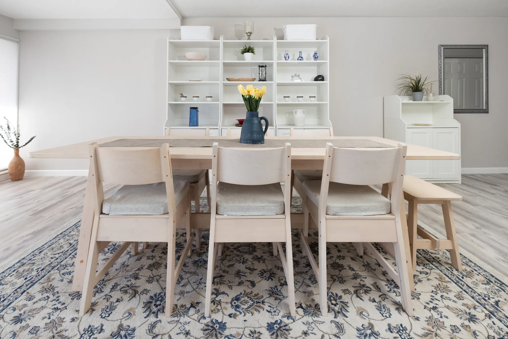 Dining area with light wood-style floors