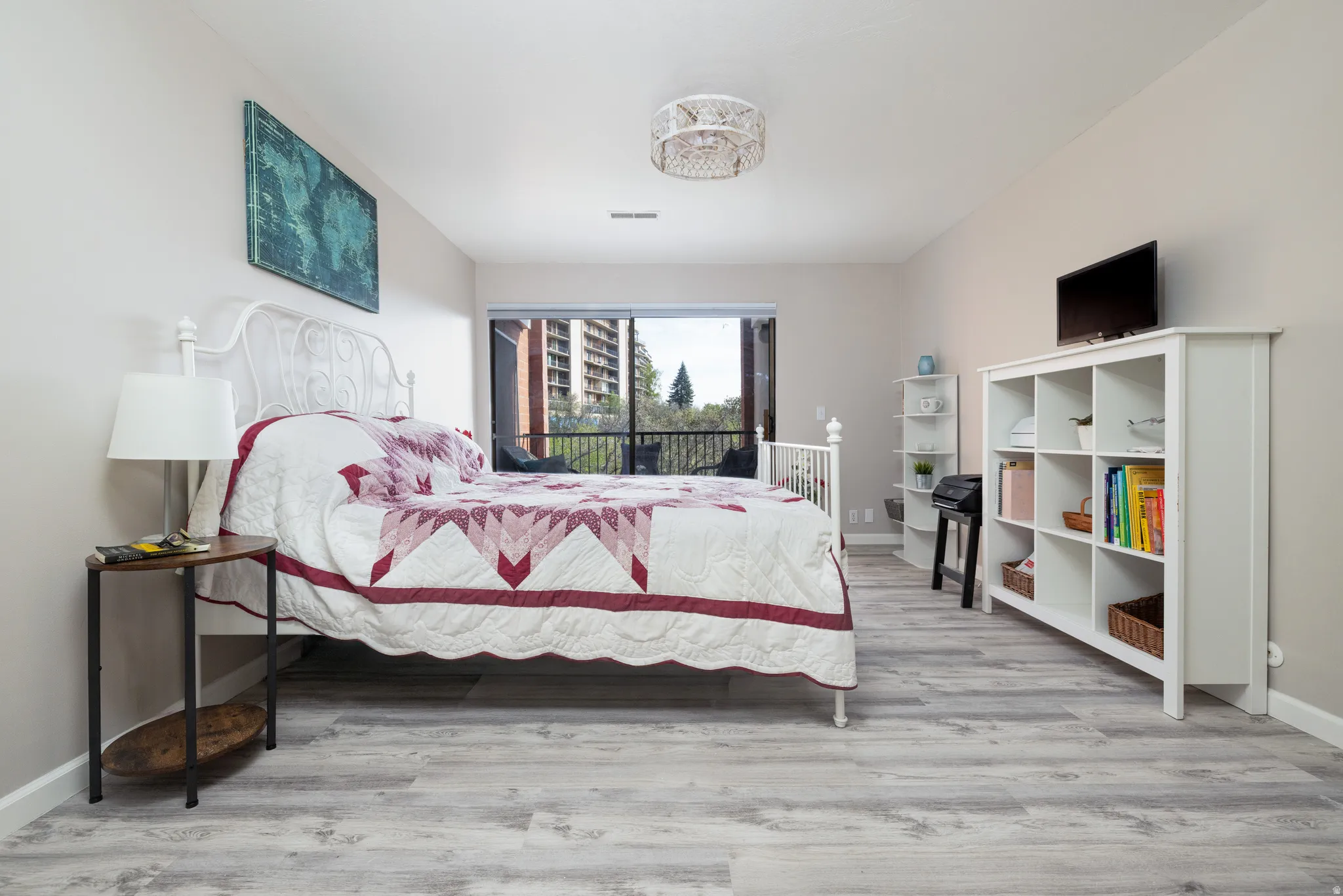 Primary bedroom with private balcony facing SW with awesome sunset and city views.