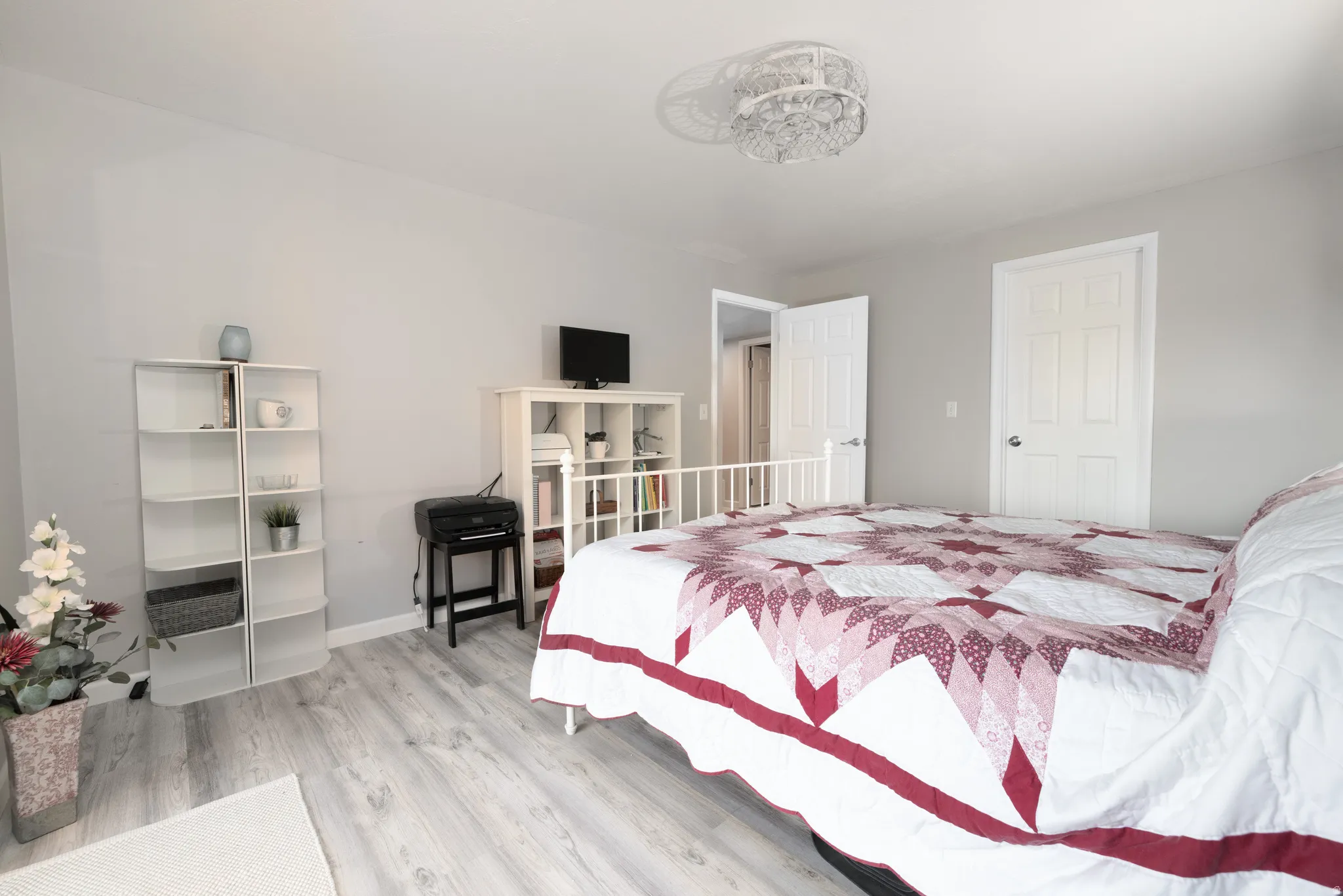 Bedroom featuring light wood-style floors and baseboards