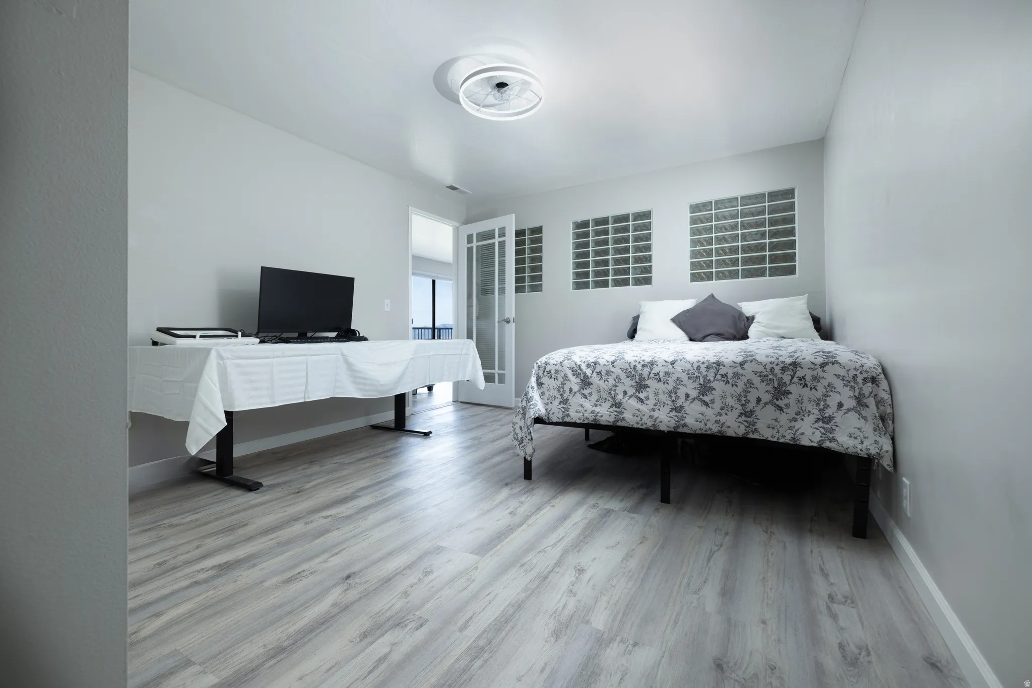 Bedroom with light wood-style floors