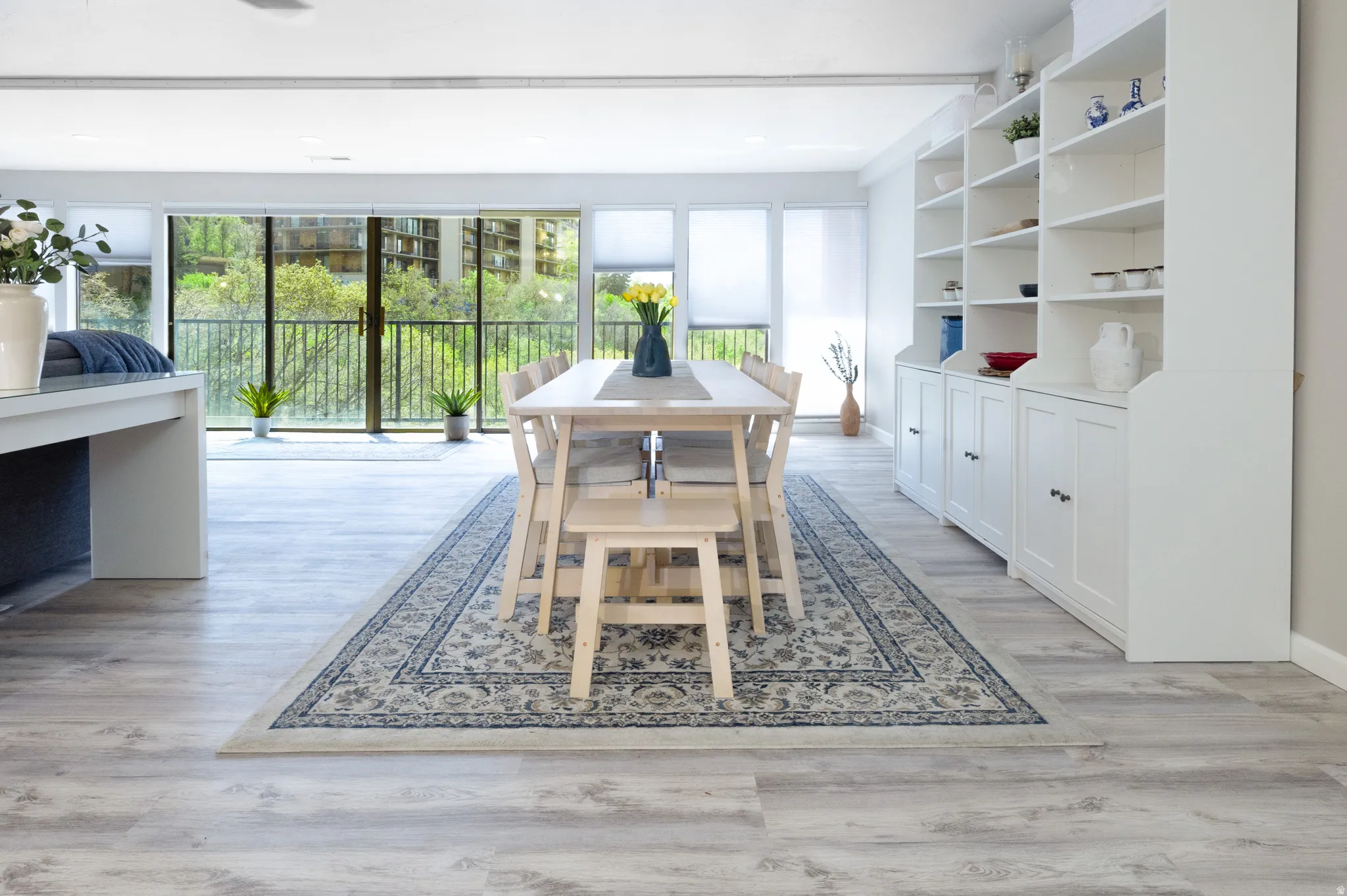 Dining room featuring light wood-style flooring and recessed lighting