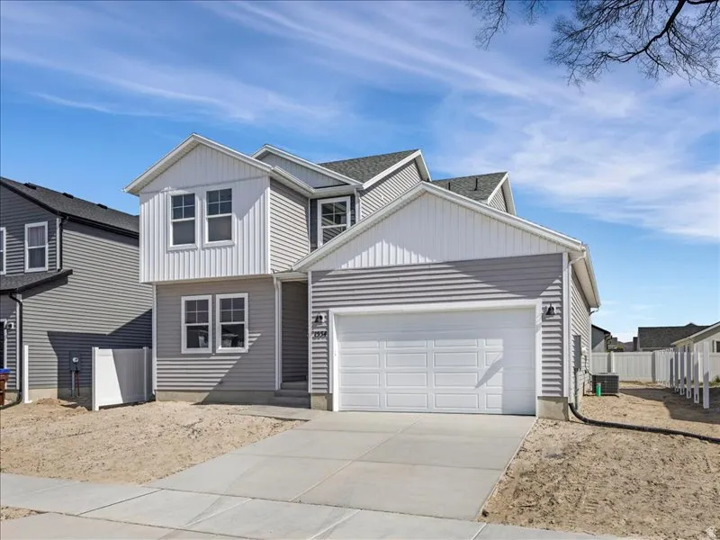 Contemporary residence featuring gray horizontal siding and white vertical siding accents