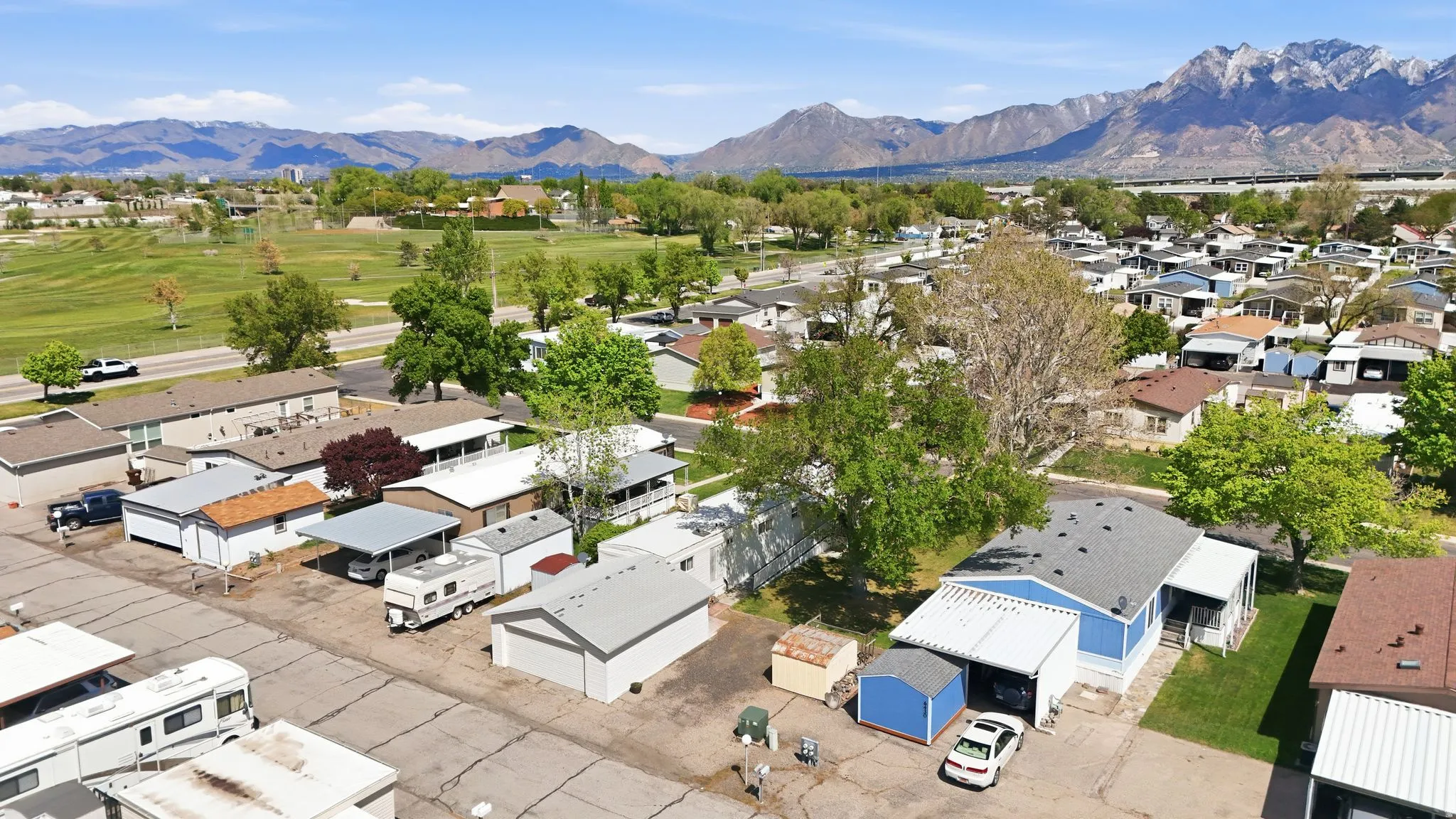 Aerial perspective of suburban area with a mountain backdrop