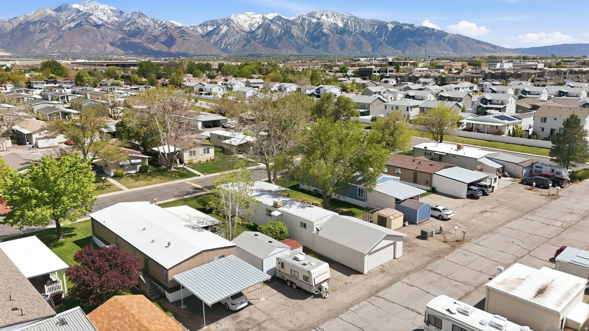 Aerial view of residential area featuring a mountainous background