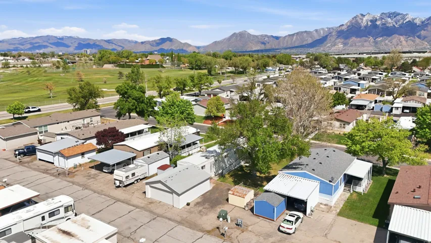Aerial perspective of suburban area with a mountain backdrop