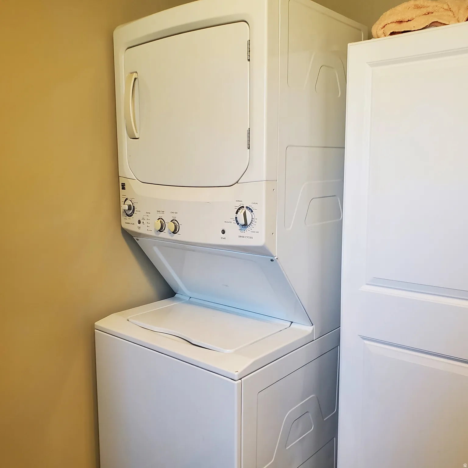 Laundry area with stacked washer / drying machine