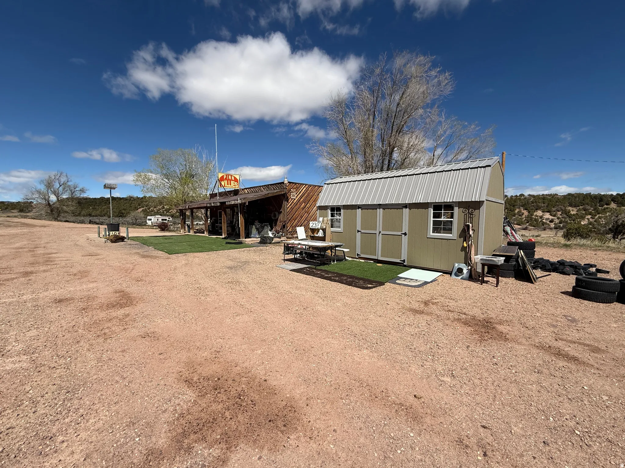 Expansive gravel lot with multiple structures