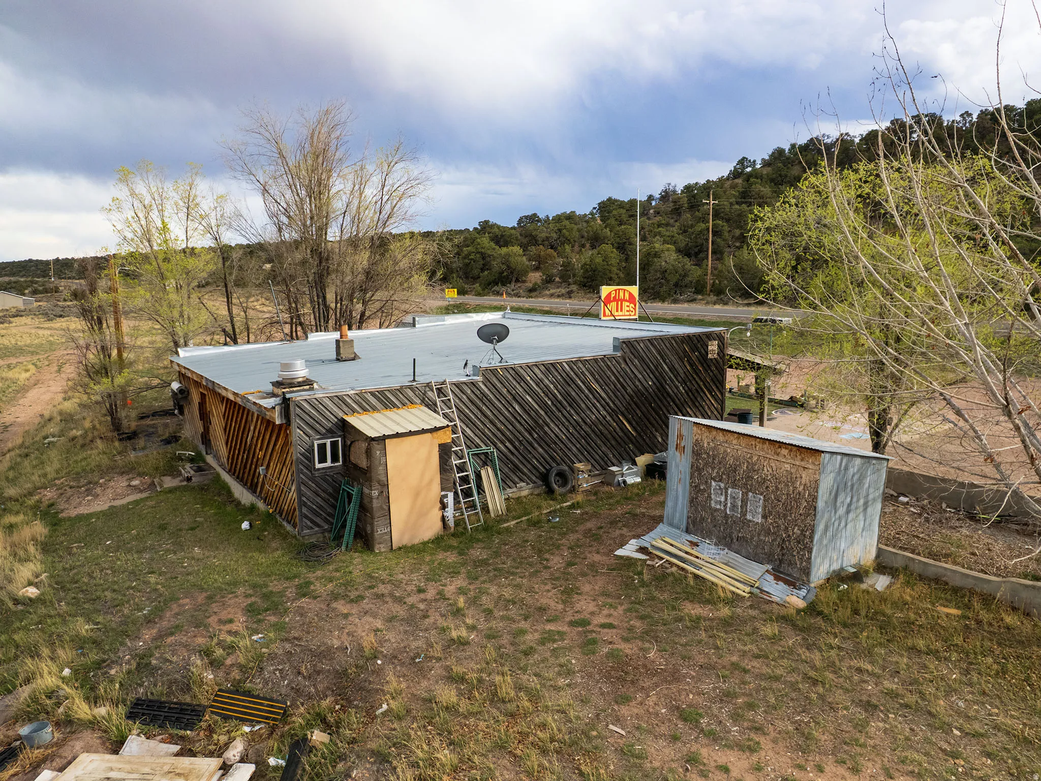 Building with a flat roof and wood siding