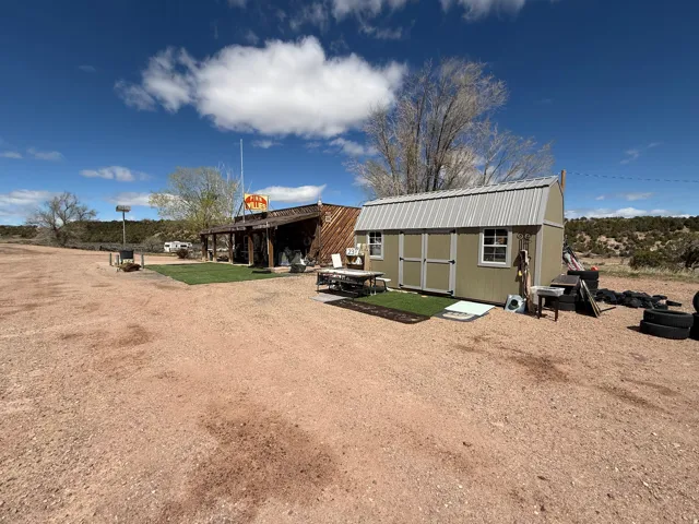 Expansive gravel lot with multiple structures