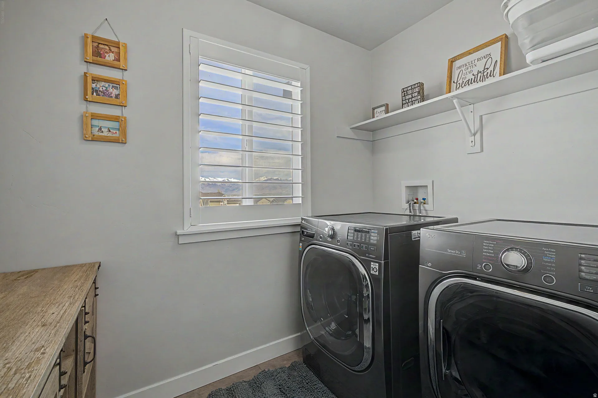 Laundry area with baseboards and washer and dryer