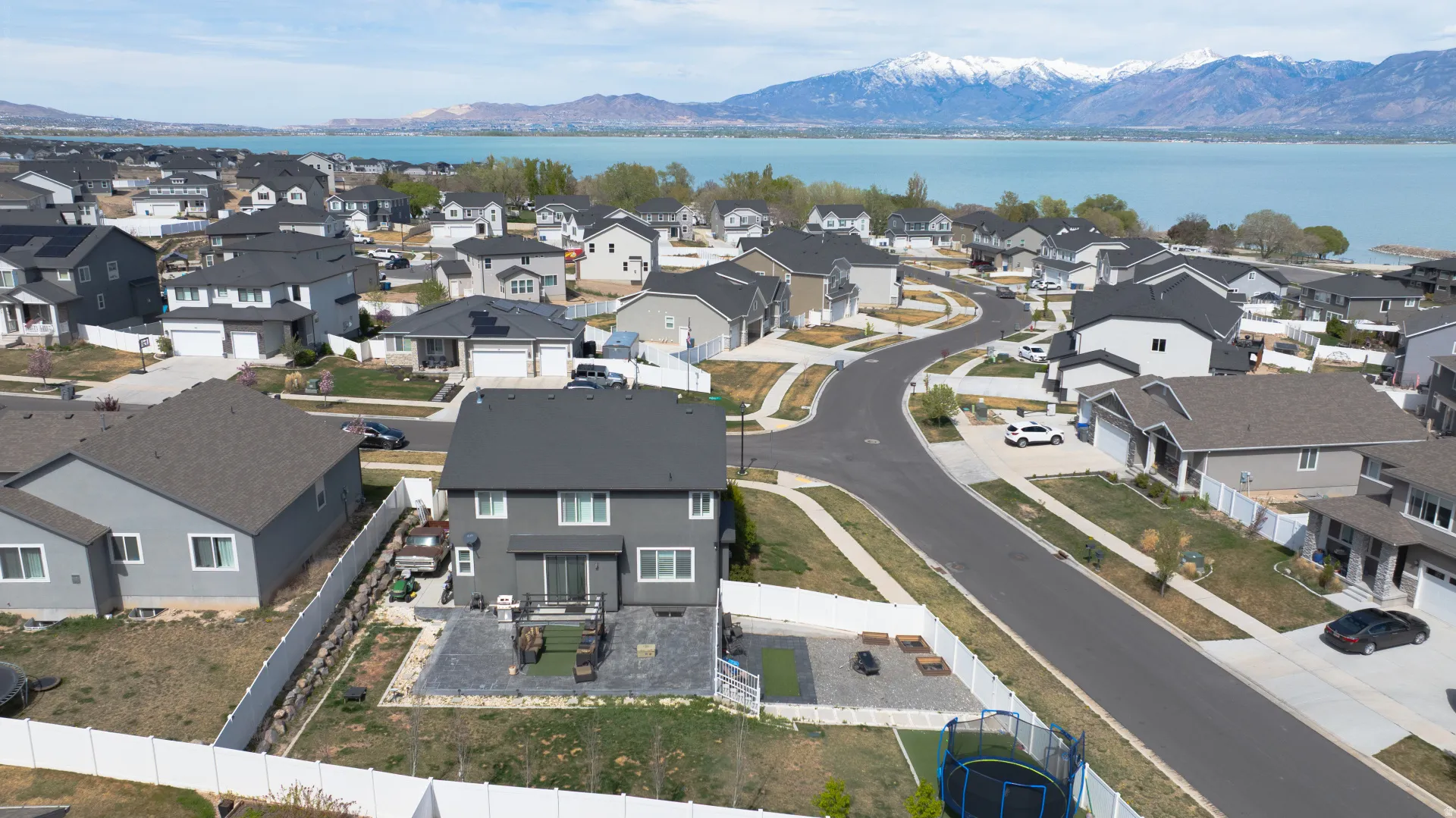 Aerial perspective of suburban area featuring a water and mountain view
