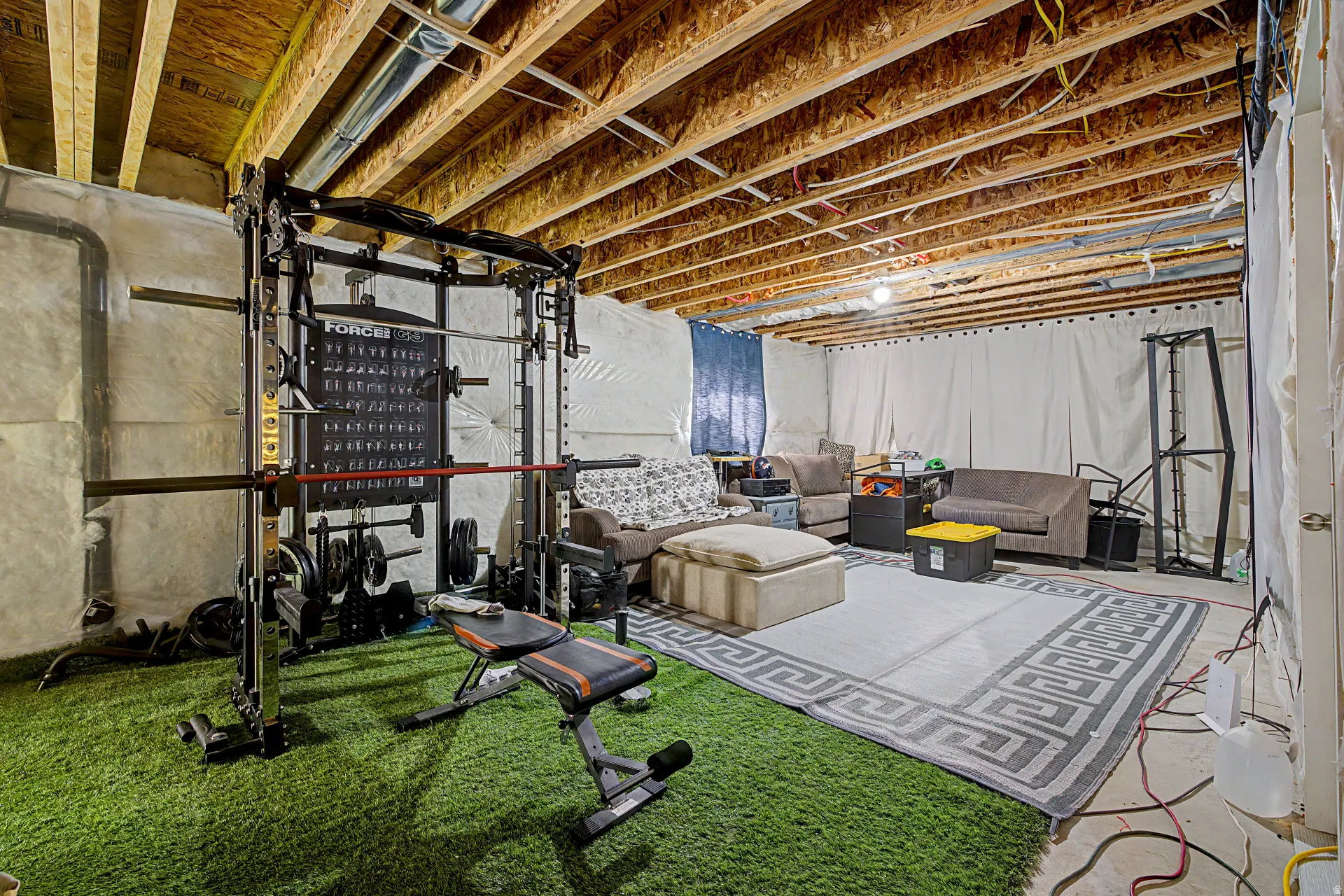 Workout room featuring concrete floors