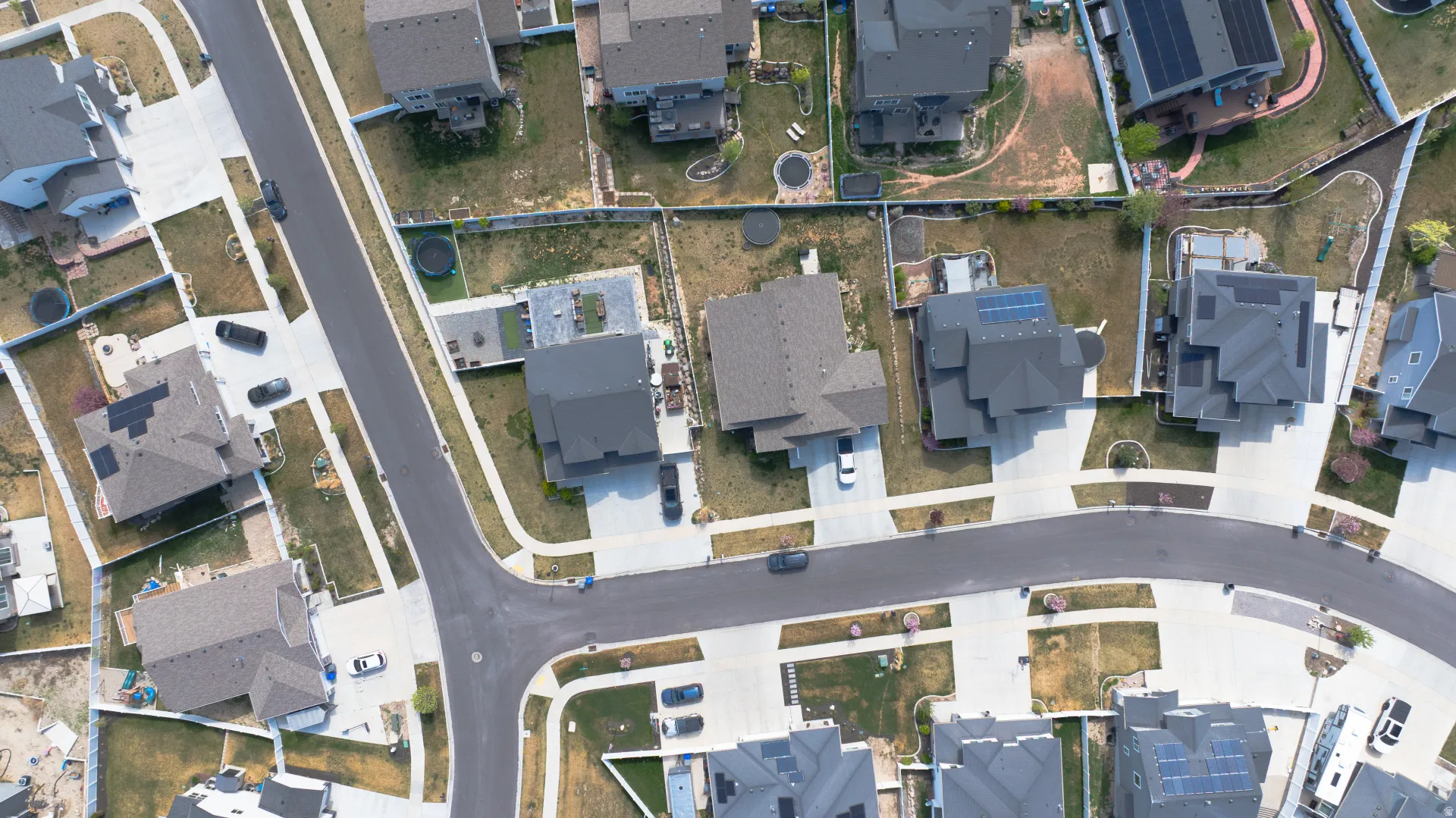 Aerial view of property and surrounding area with nearby suburban area