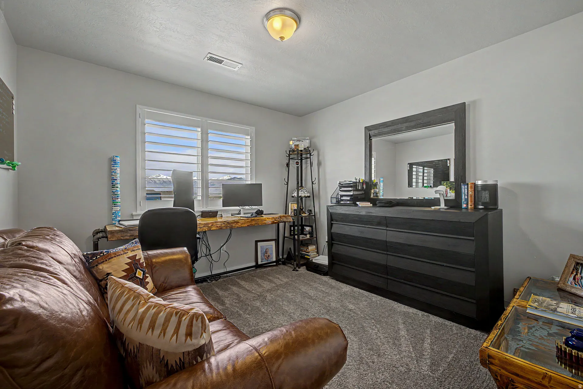 Office space with dark colored carpet