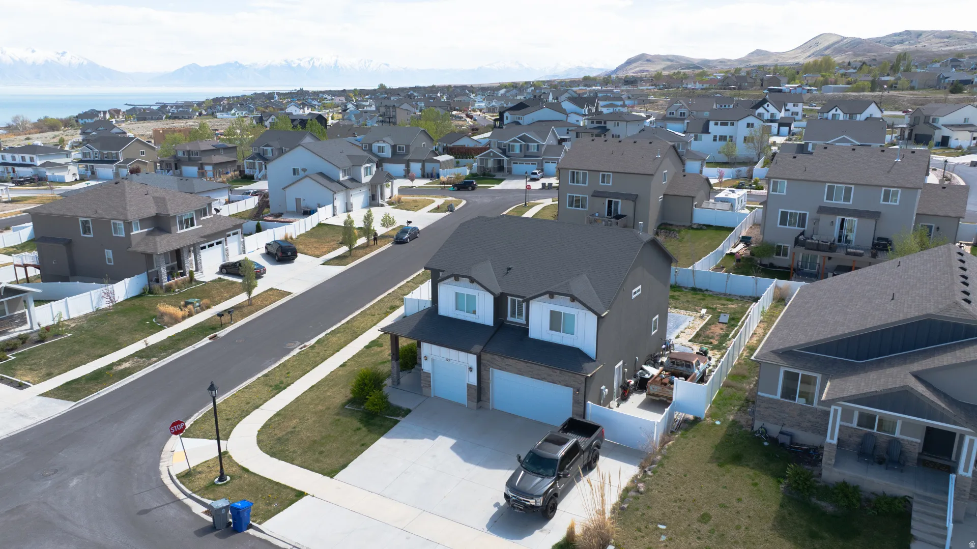 Aerial view of residential area featuring a mountain backdrop