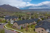 Aerial view of residential area featuring a mountainous background