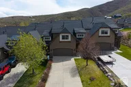 View of front facade with driveway, an attached garage, and a mountain view