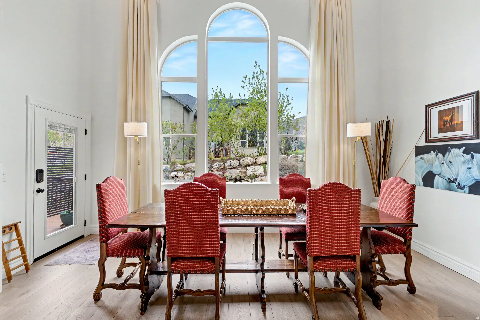 Dining space featuring light wood-type flooring and baseboards