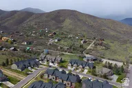 Aerial perspective of suburban area with a mountainous background