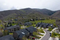 Aerial view of residential area featuring a mountainous background