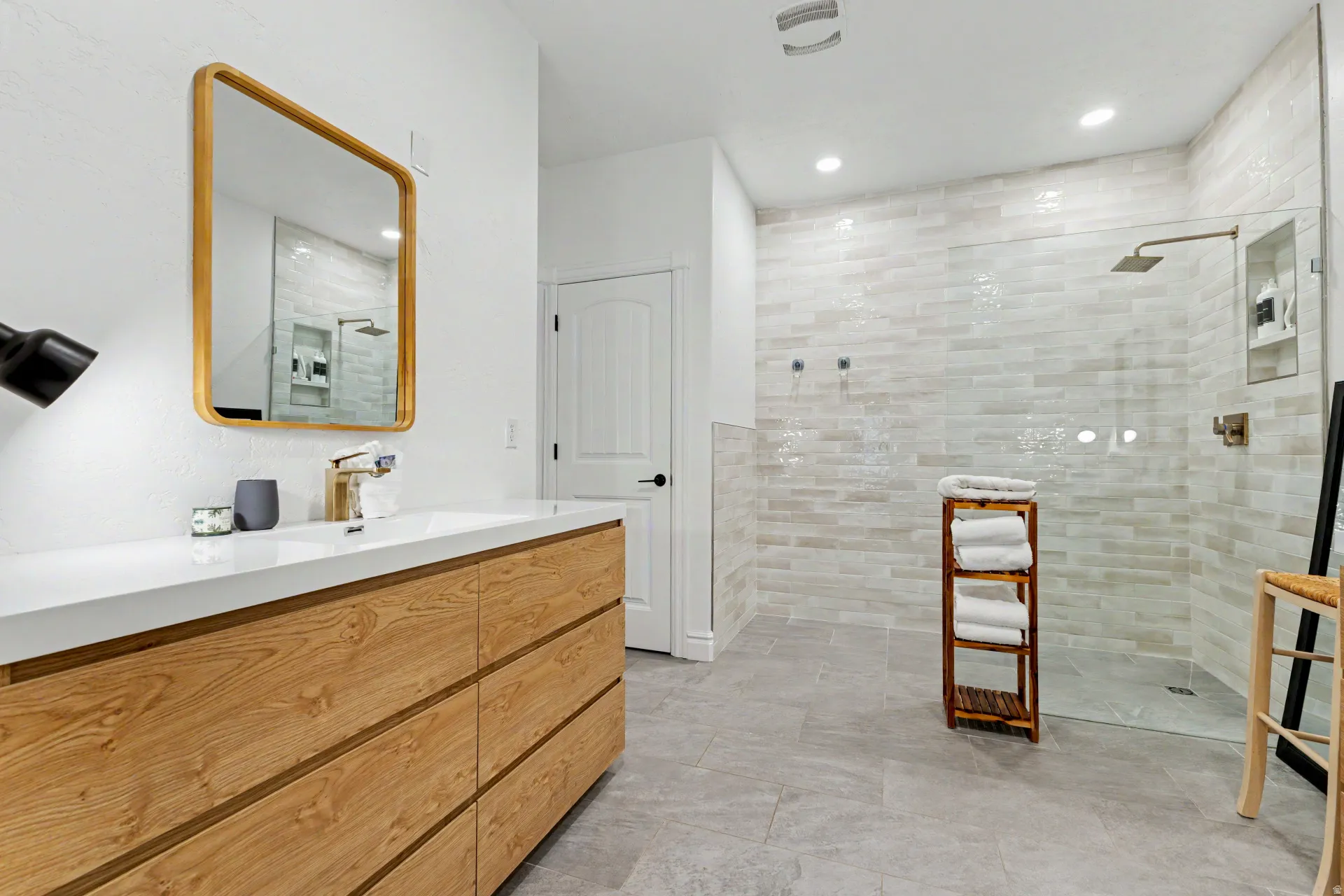 Full bathroom with vanity, walk in shower, and recessed lighting