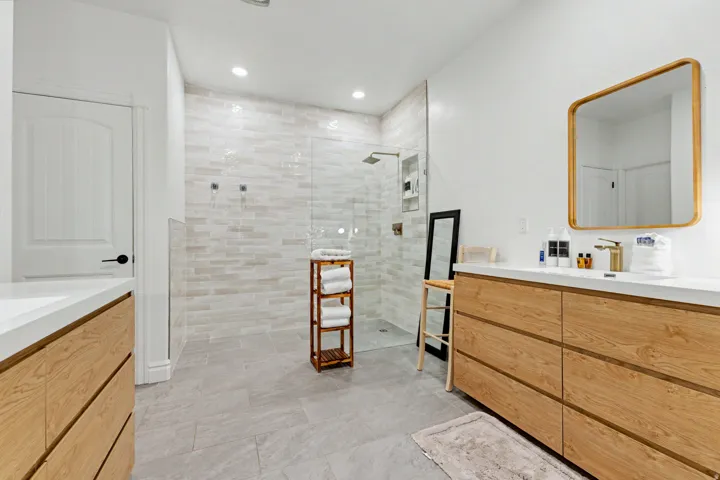 Full bathroom with vanity, a walk in shower, and recessed lighting