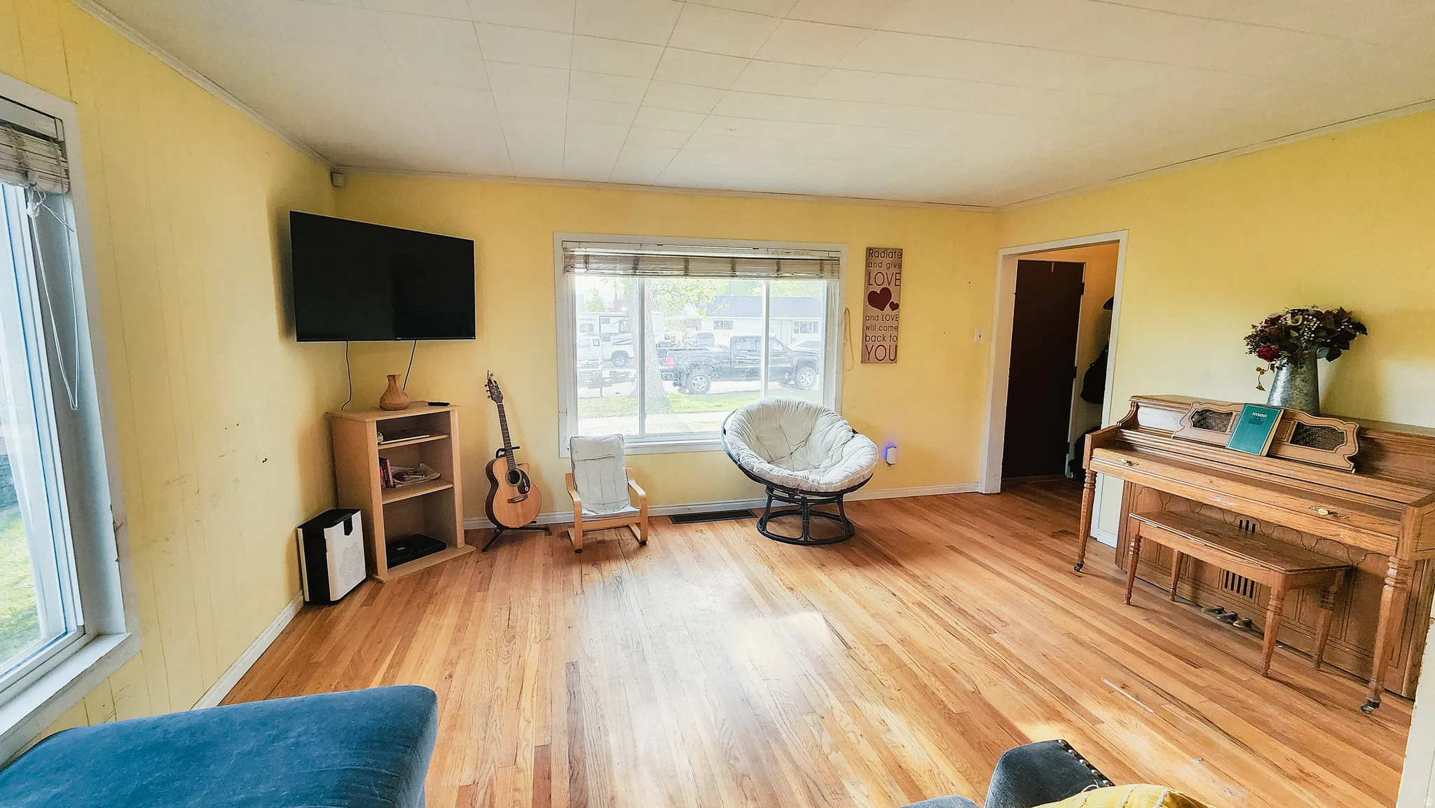 Sitting room featuring light wood-style floors and baseboards