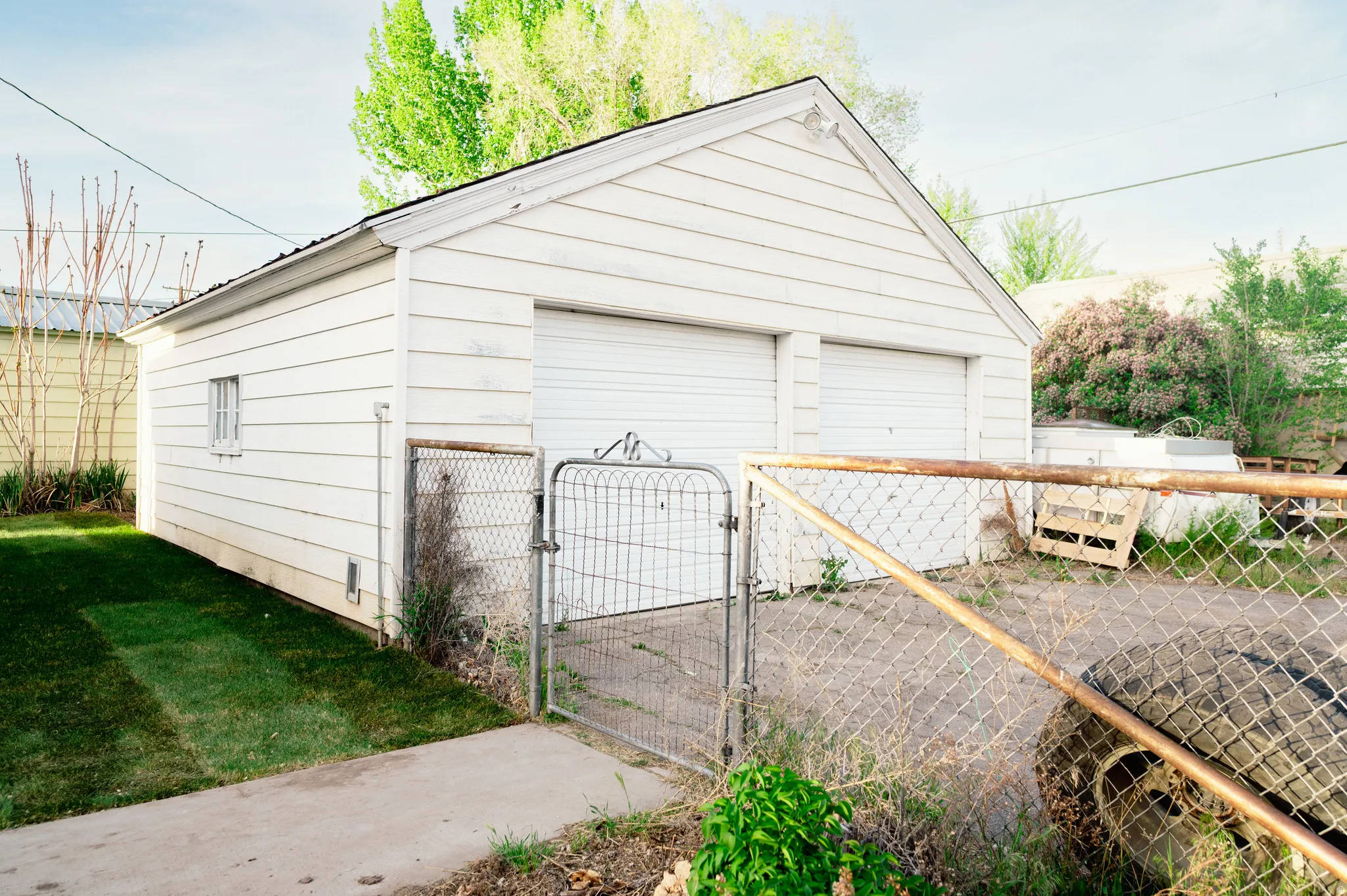 Detached garage with a gate