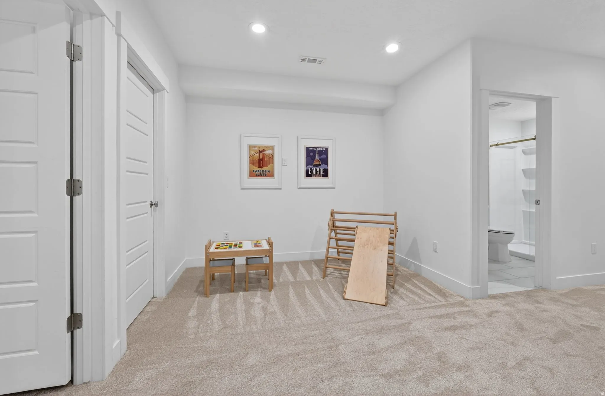 Sitting room featuring light colored carpet and recessed lighting